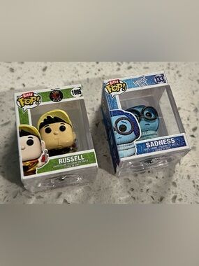 Funko Bitty Pop! Figures Sadness (#133) and Russell (#1095)